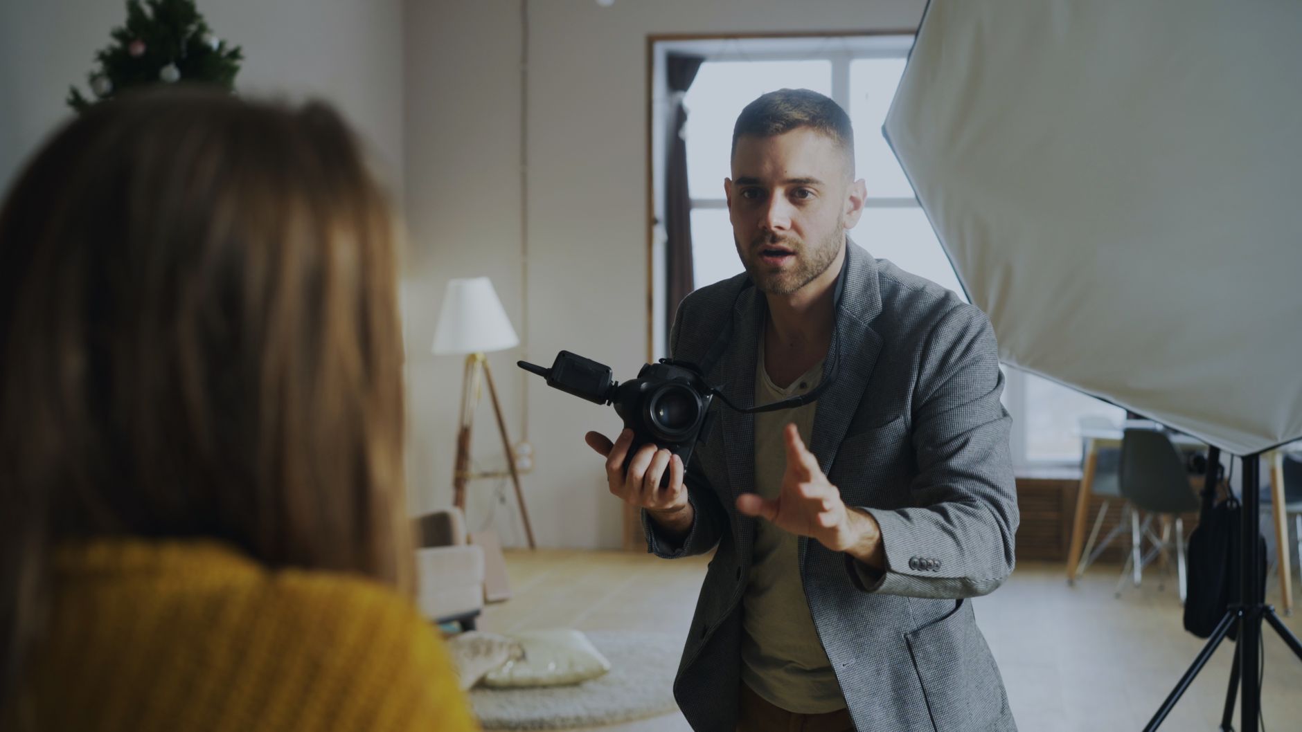 Photographer directing a subject in the studio